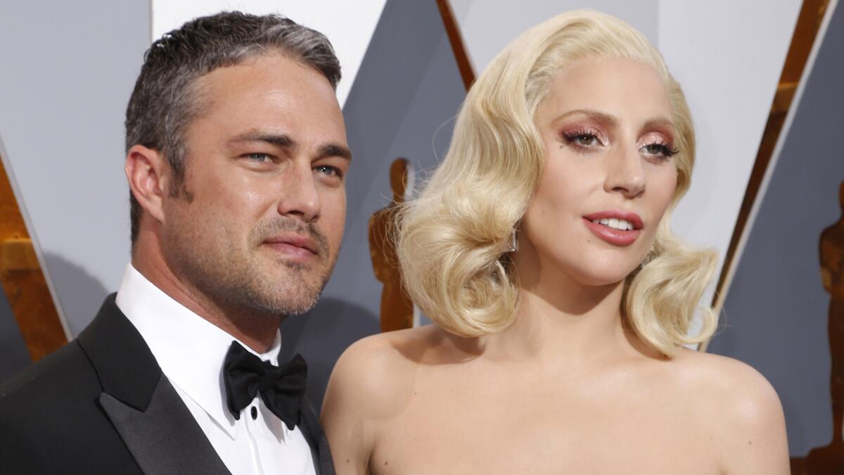 Taylor Kinney and Lady Gaga at the 88th Academy Awards in February.