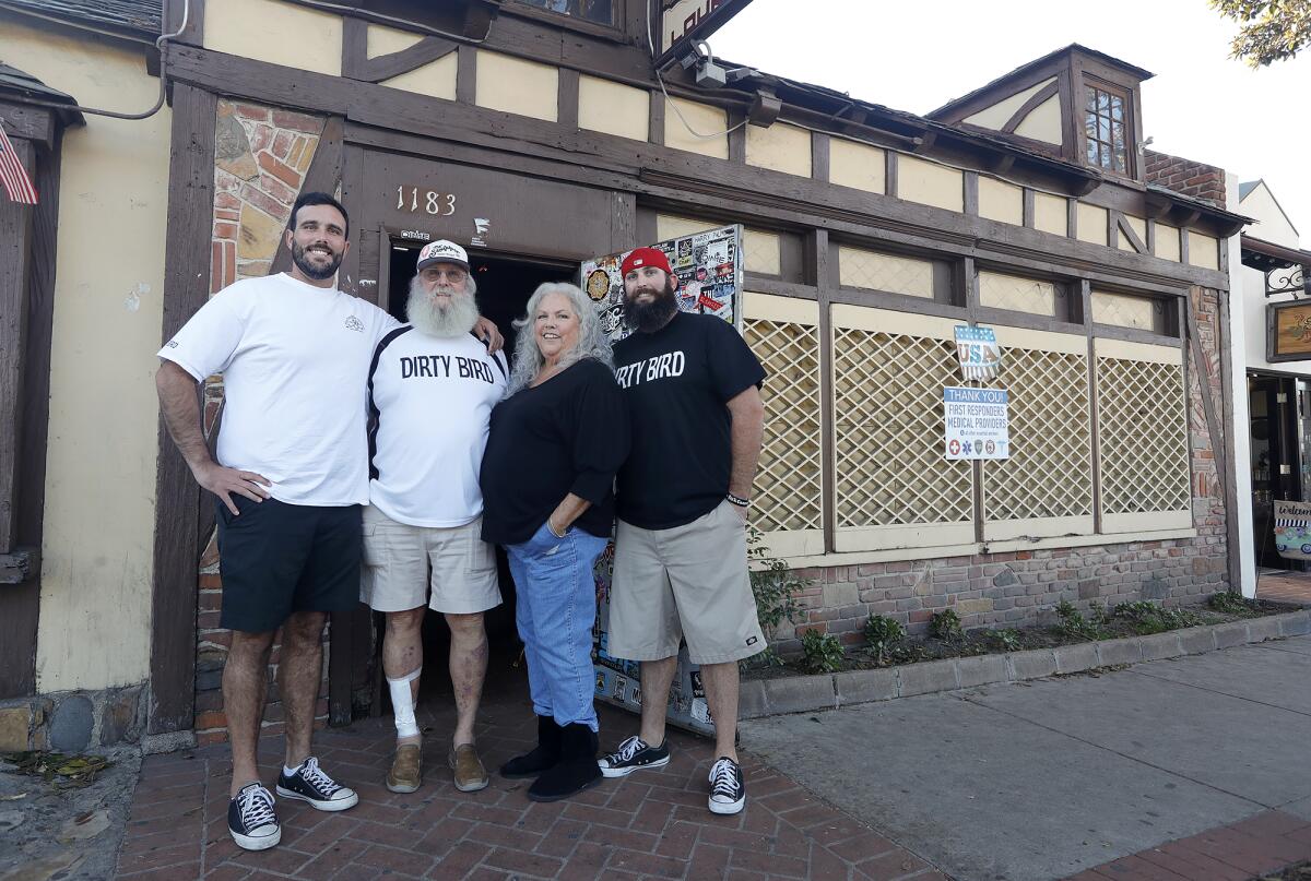 Spencer, Chuck, Jeannie, and Grant Harrell, from left, stand outside the Sandpiper Lounge in Laguna Beach.