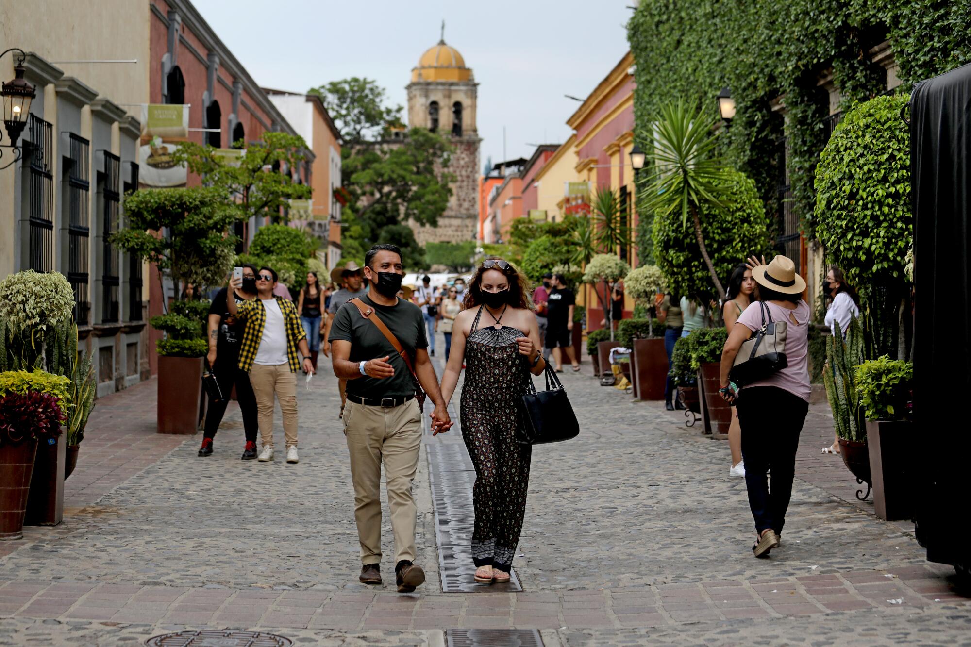 People stroll along Calle Jose Cuervo in Tequila, Jalisco