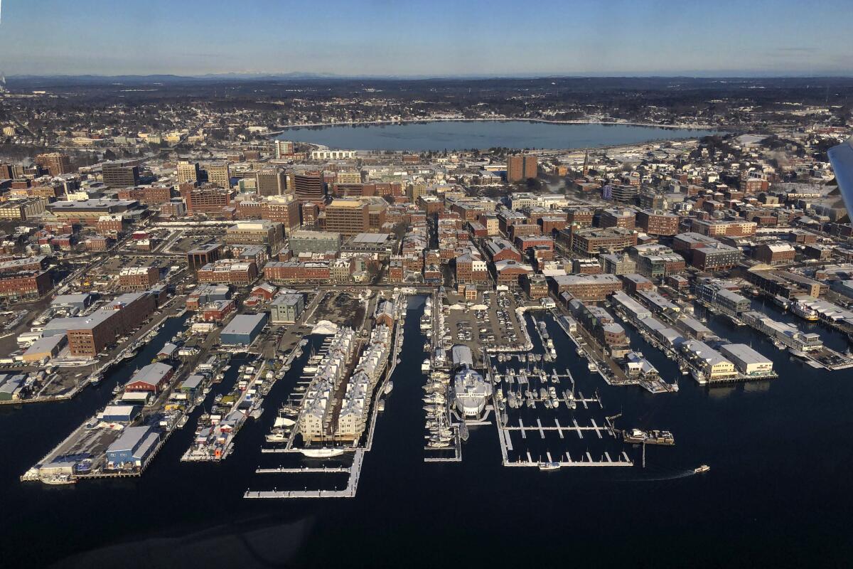 Trump's trade fights have heightened uncertainty for corporations. Above, the waterfront in Portland, Maine.