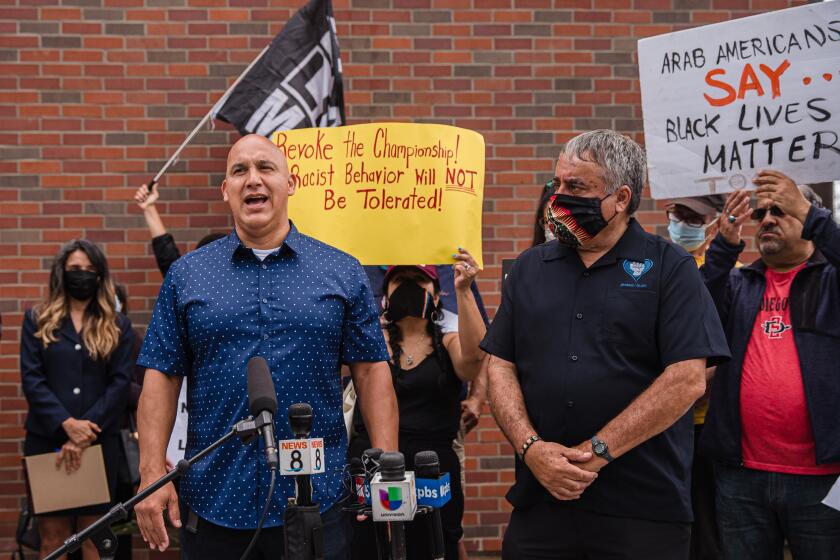 Andres Rivera, a father of an Orange Glen High School basketball player, speaks at a rally in front of Coronado High School on June 22, 2021 over a racist incident at an Orange Glen and Coronado High basketball game.