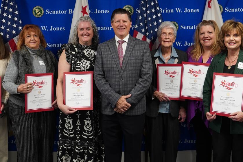 Robin Joy Maxson, second from left, celebrates her honor with fellow “Distinguished Women” of the 40th Senate District.