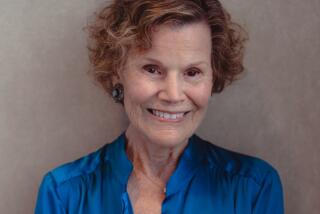 Author Judy Blume wears a blue blouse and smiles for a portrait