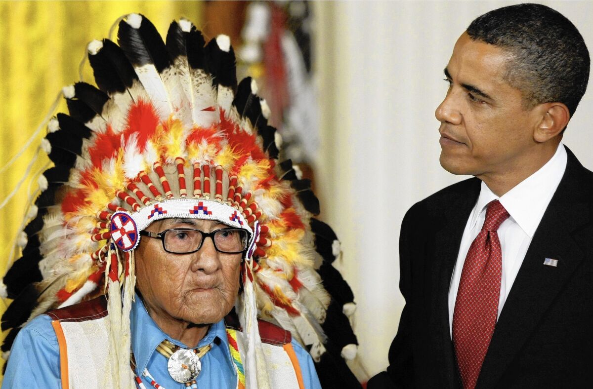 President Obama presents the 2009 Presidential Medal of Freedom to Joseph Medicine Crow, an acclaimed Native American historian who was the Crow Tribe's last surviving war chief.
