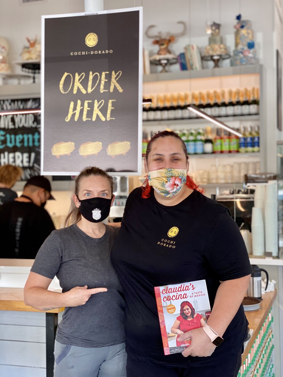 Maeve Rochford (left) and Claudia Sandoval at Sugar & Scribe, where Sandoval's Cochi Dorado goods will be sold through June.