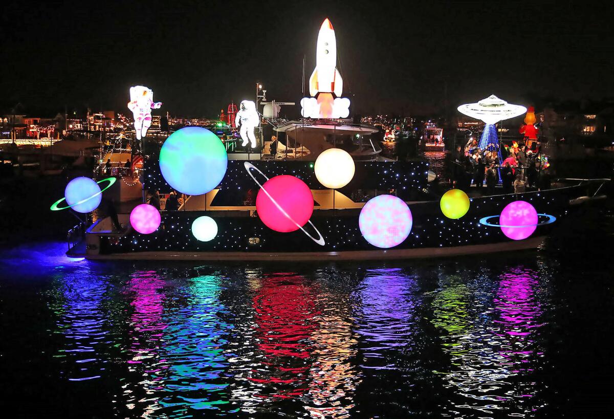 The "Last Hurrah," with a planetary theme, dazzles Wednesday on opening night of the Newport Beach Christmas Boat Parade.