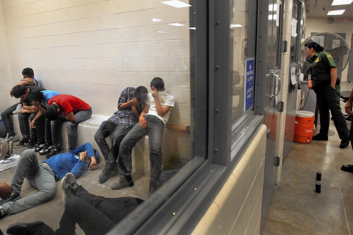 Immigrants are held at a Border Patrol station in McAllen, Texas, on July 15.