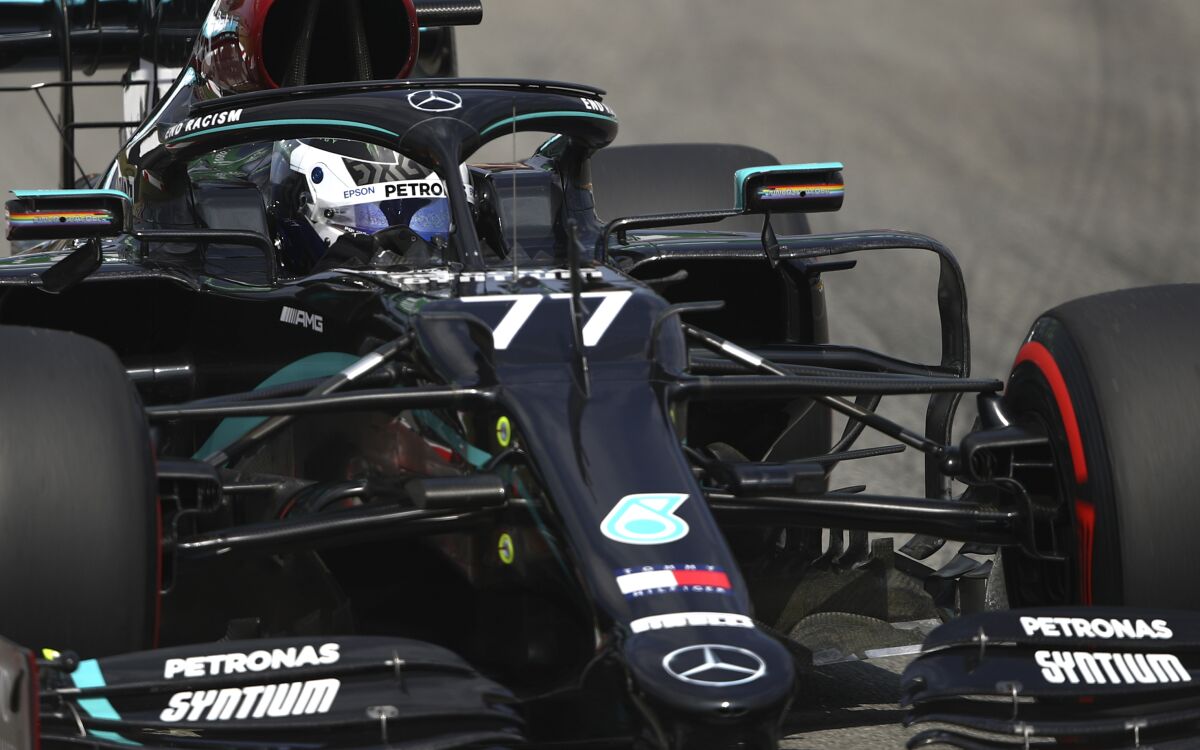 Mercedes driver Valtteri Bottas of Finland steers his car during a practice session prior to the Formula One Grand Prix at the Barcelona Catalunya racetrack in Montmelo, Spain, Friday, Aug. 14, 2020. (Bryn Lennon, Pool via AP)