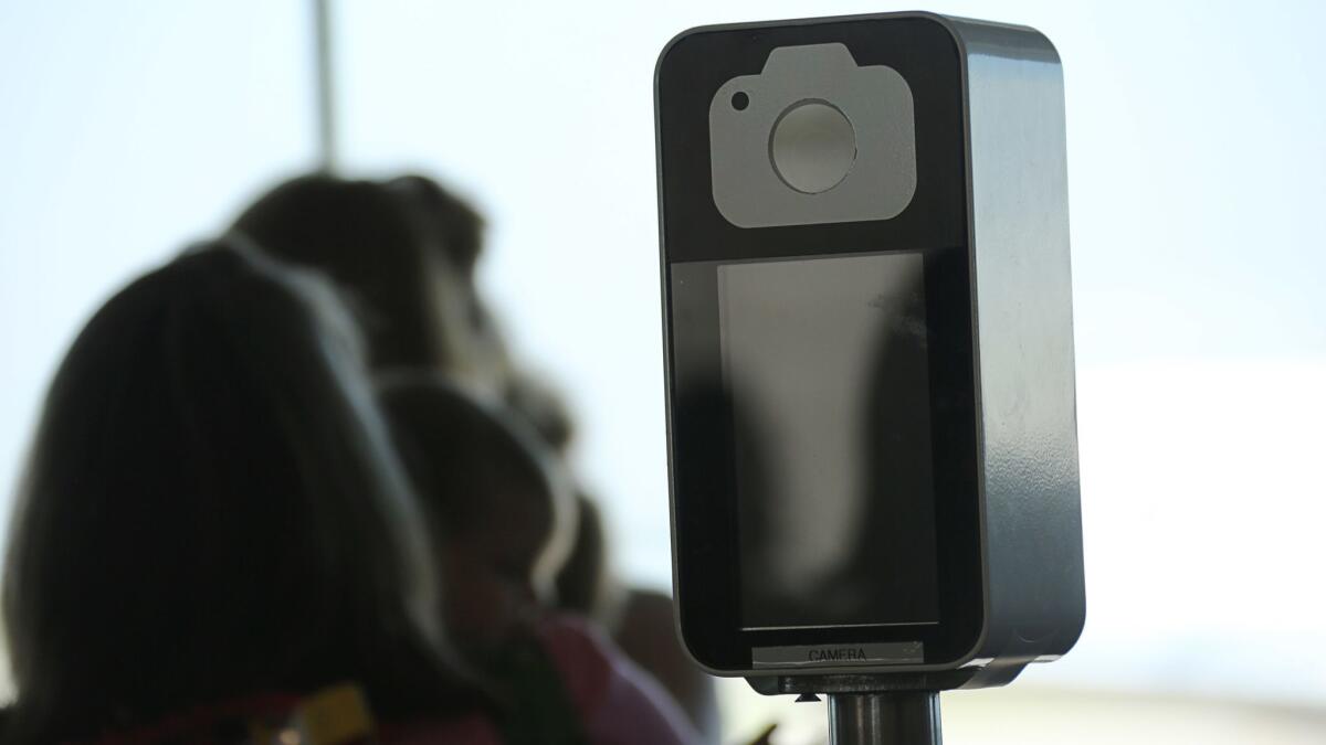 A camera in a facial recognition screening device at Orlando International Airport in Florida.