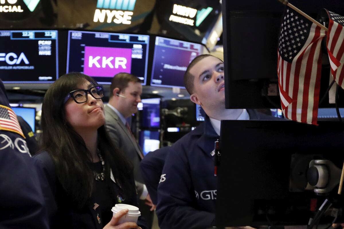 Specialist Erica Fredrickson and a colleague on the floor of the New York Stock Exchange on Monday
