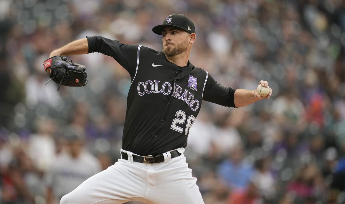 Colorado Rockies starting pitcher Austin Gomber works against the Miami Marlins during the first inning of a baseball game Saturday, Aug. 7, 2021, in Denver. (AP Photo/David Zalubowski)