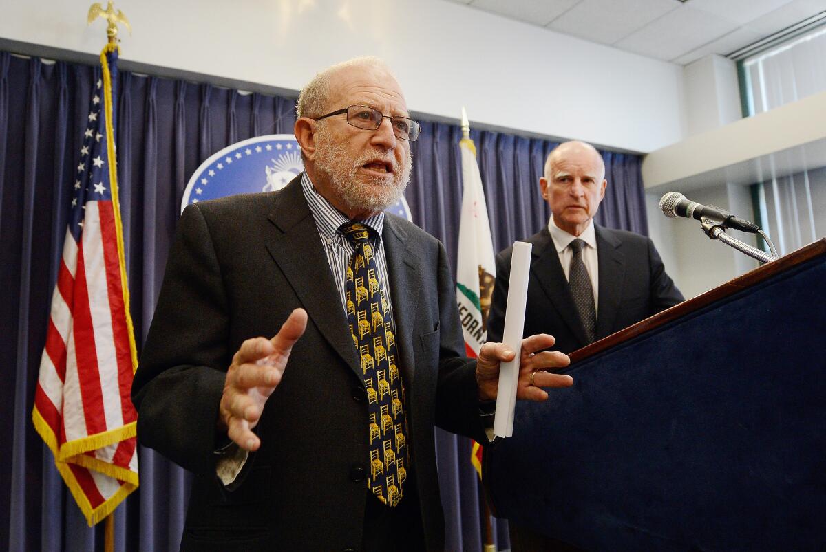 Marty Morgenstern, appearing with then-Gov. Jerry Brown during a 2012 news conference in Los Angeles, died on Feb. 5.