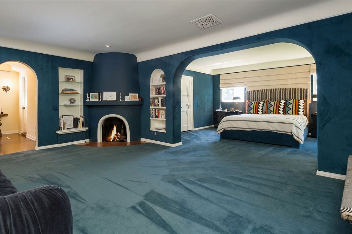 The master suite has a fireplace and a sitting room.