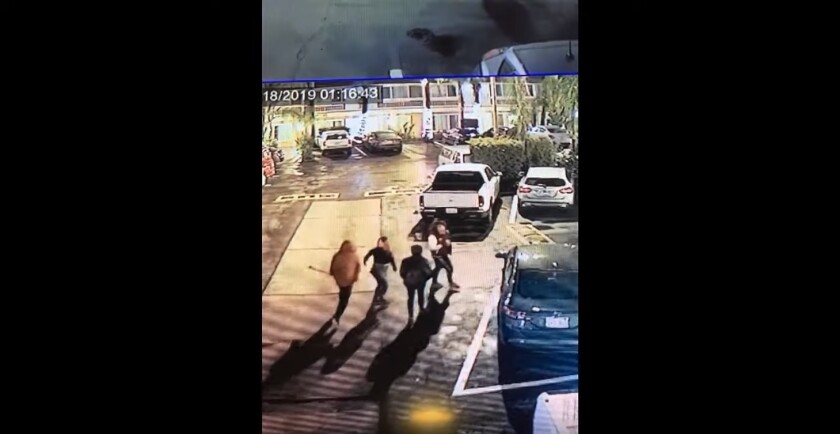 A screen captures of the video released by police shows the three suspects in a robbery investigation