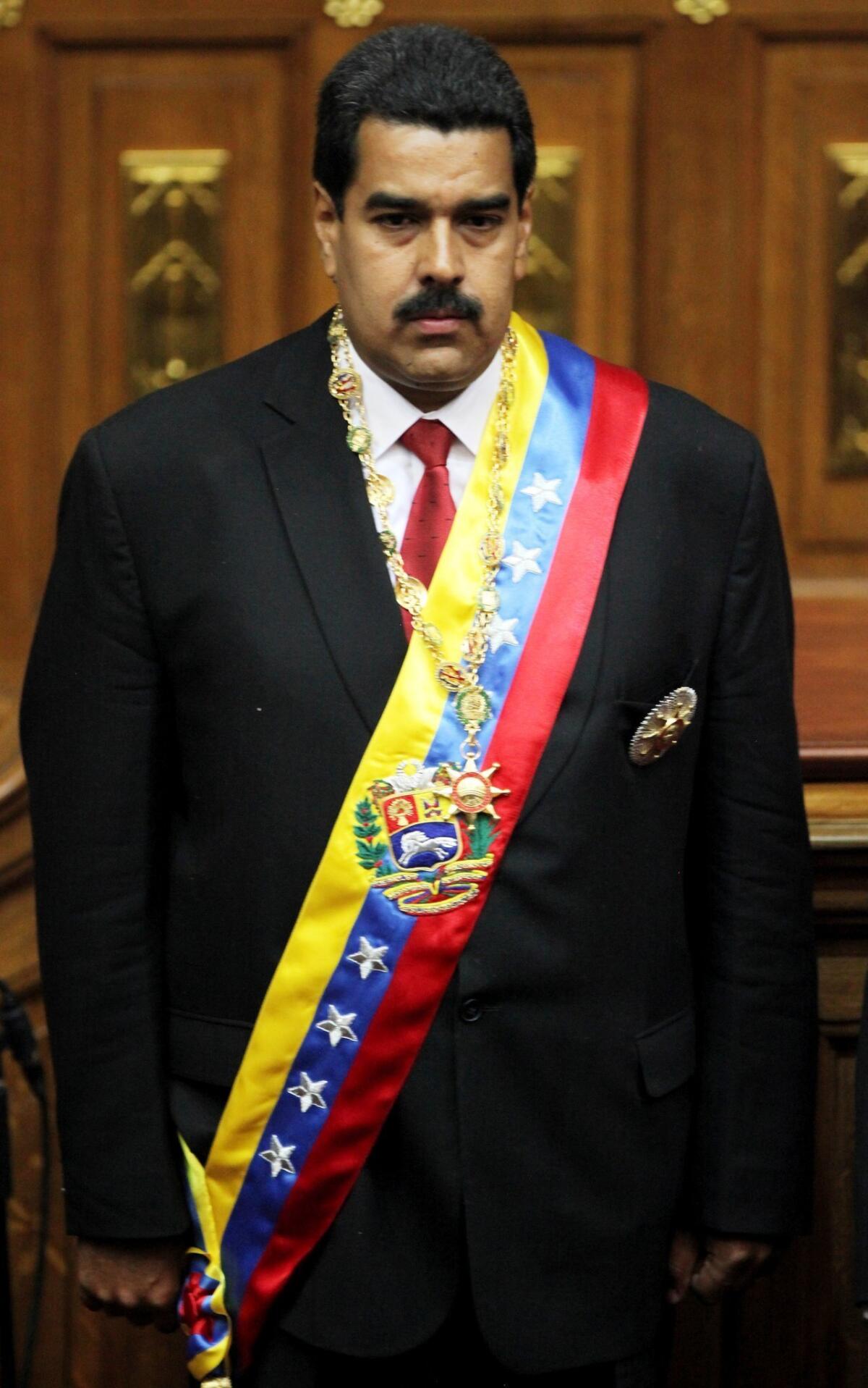 Venezuela's newly sworn-in President Nicolas Maduro pauses during the singing of the national anthem in the National Assembly in Caracas on Friday.