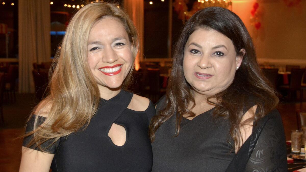Christina Longacre, left, and Magie Sardarov, who serve as the co-presidents of the Burbank Chapter of NCL arriving at the Castaway for last week's fundraiser.