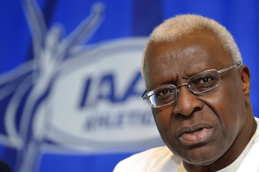 Lamine Diack, the former president of the international track federation, is shown in Berlin in 2009. He is now under criminal investigation on corruption and bribery allegations.