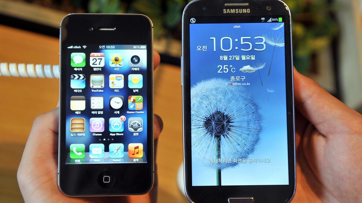 Apple's iPhone 4s, left, and a Samsung's Galaxy S3, right.