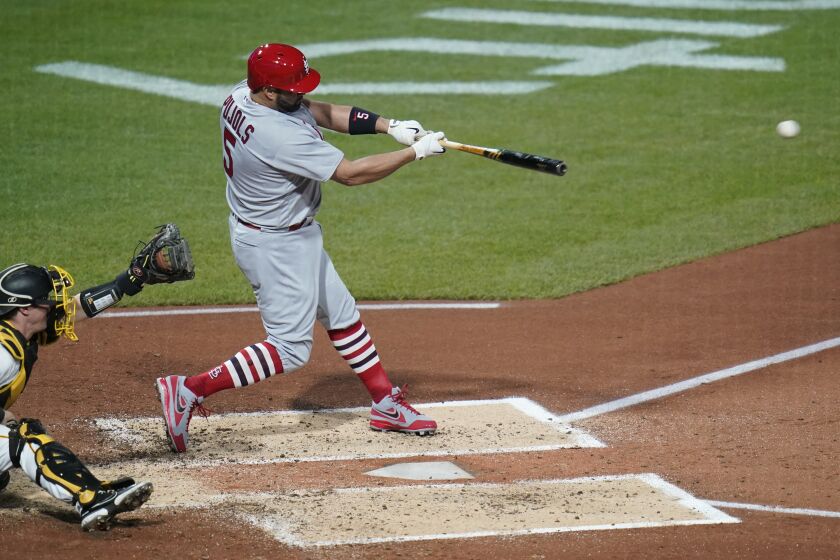 St. Louis Cardinals' Albert Pujols hits a two-run single against the Pittsburgh Pirates during the third inning of a baseball game Tuesday, Oct. 4, 2022, in Pittsburgh. (AP Photo/Keith Srakocic)