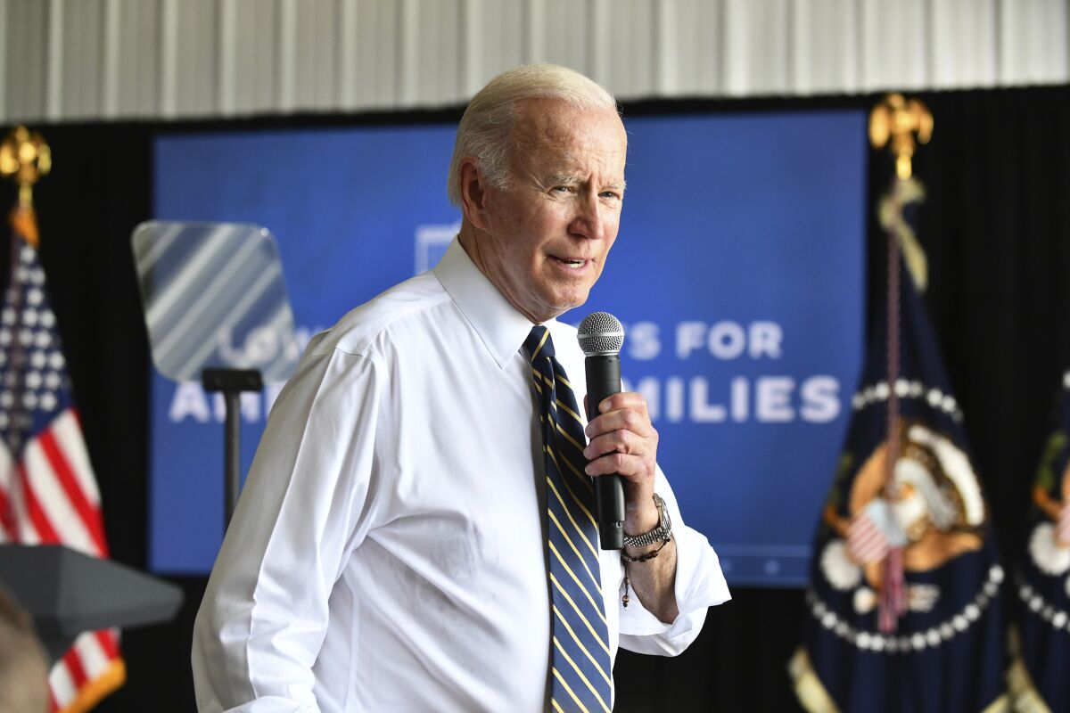 President Joe Biden speaks to Kankakee County representatives, Illinois officials and area residents in attendance Wednesday during a visit to Jeff O'Connor's farm in Kankakee, Ill., Wednesday, May 11, 2022. (Tiffany Blanchette/The Daily Journal via AP)