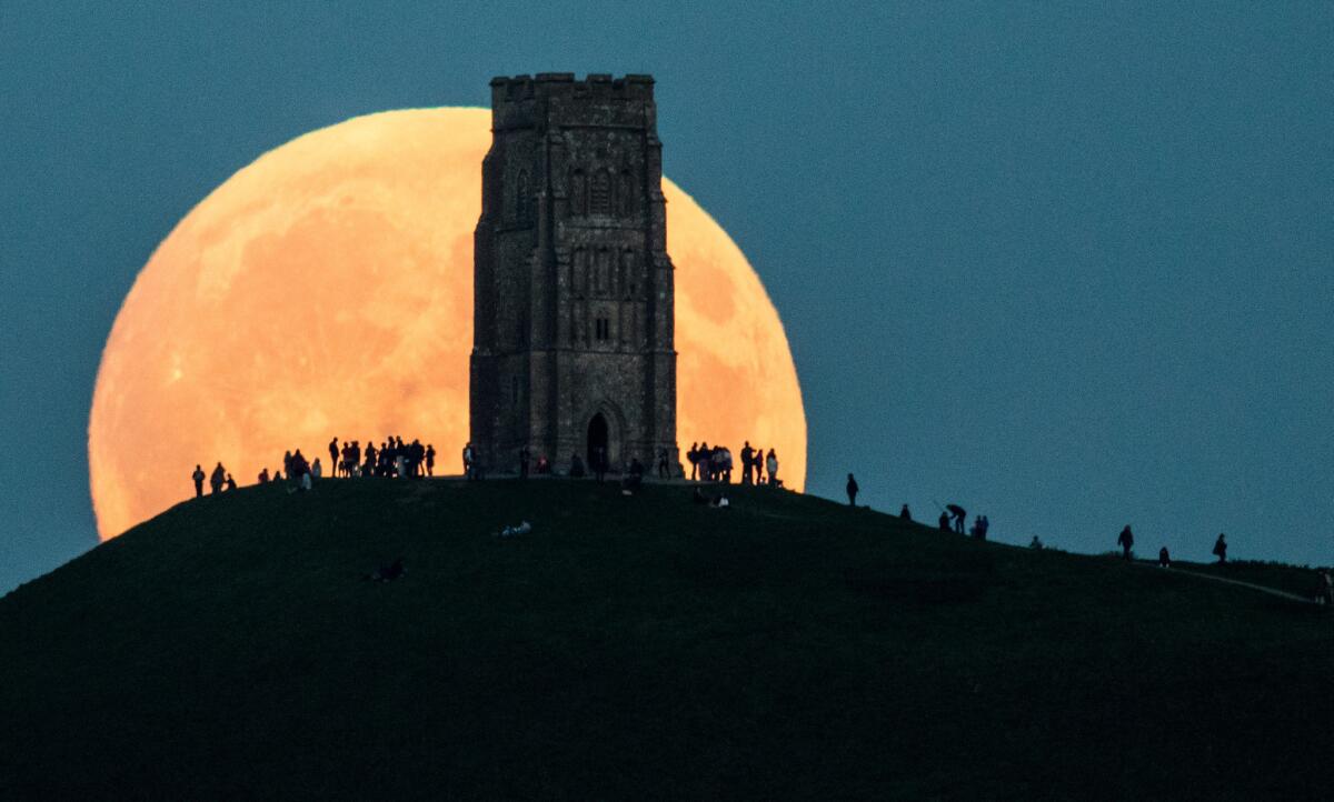 The moon rises behind Glastonbury Tor on September 27, 2015, in Glastonbury, England.