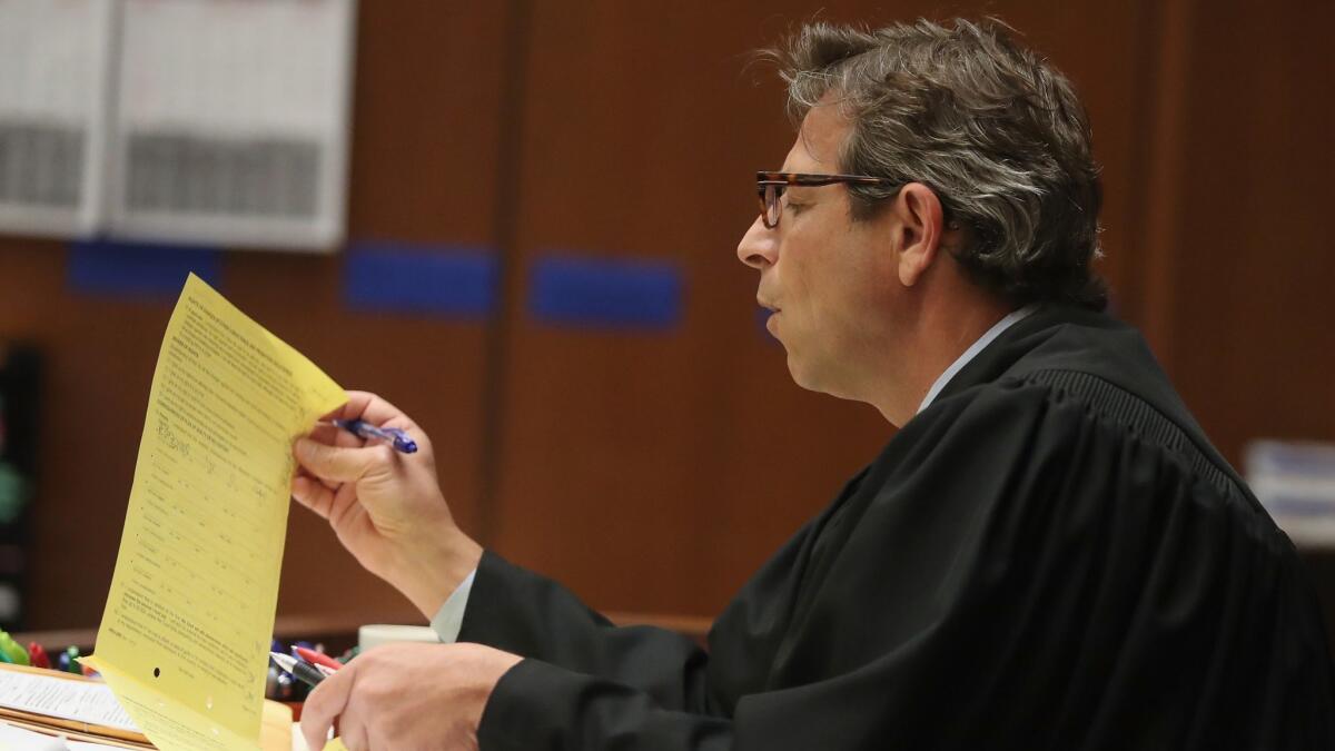 Judge Gustavo N. Sztraicher reversed his order barring journalists from publishing courtroom photos of a Houston man charged with killing multiple homeless people.