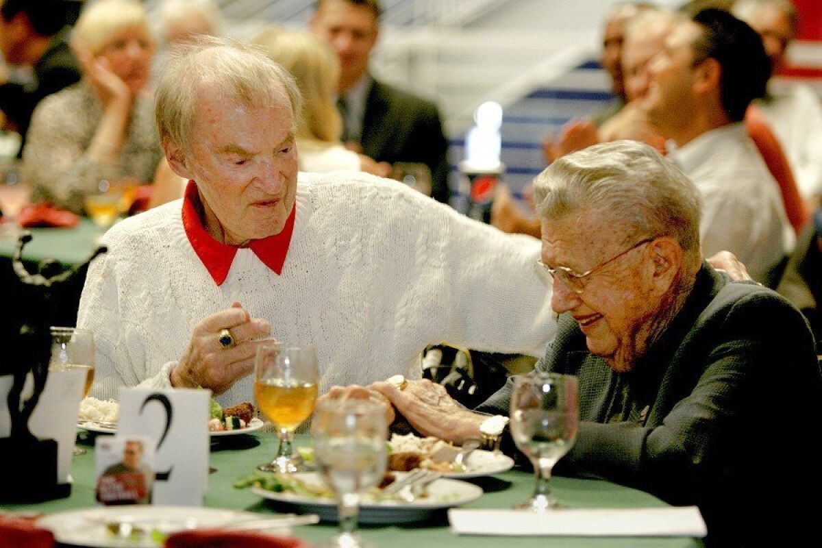 Don Coryell talks with San Diego Hall of Champions founder Bob Breitbard at a luncheon at the Balboa Park sports museum in July 2009.