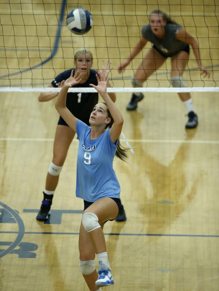 Corona del Mar High's Ashley Humphreys sets in the Battle of the Bay girls' volleyball match at Newport Harbor.