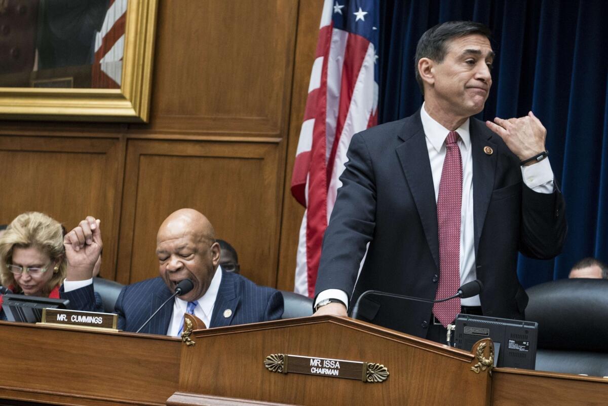 Rep. Darrell Issa motions to Republican staff members to cut off the microphone of Rep. Elijah E. Cummings, left, during a hearing of the House Oversight and Government Reform Committee on Wednesday.