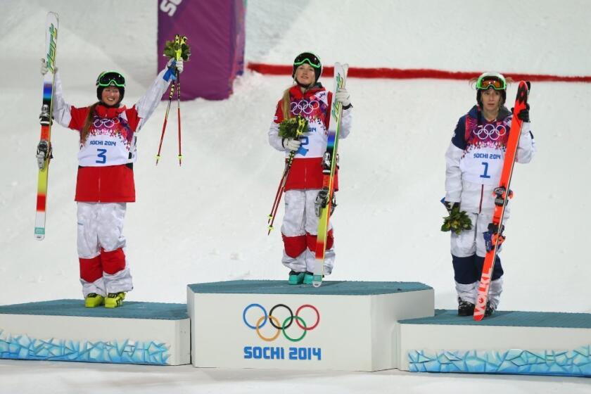 From left to right, silver medalist Chloe Dufour-Lapointe of Canada, gold medalist Justine Dufour-Lapointe of Canada and bronze medalist Hannah Kearney of the United States.