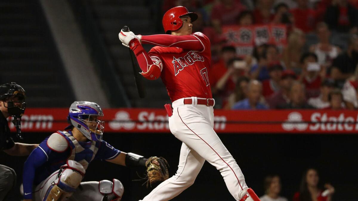 Angels' Shohei Ohtani hits a double in the fourth inning.