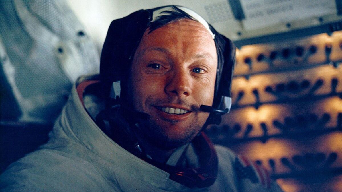 Armstrong smiles inside the Lunar Module on July 20, 1969.