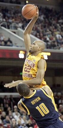 USC forward Taj Gibson elevates for a dunk over California forward Jamal Boykin during the second half Saturday.