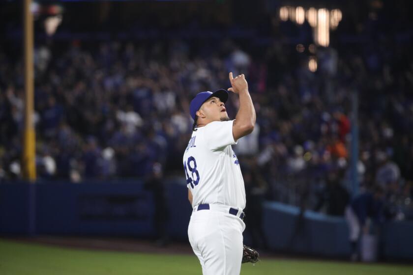 Los Angeles, CA - June 23: Dodgers relief pitcher Brusdar Graterol celebrates after beating the Astros 3-2 in the ninth inning at Dodger Stadium in Los Angeles Friday, June 23, 2023. (Allen J. Schaben / Los Angeles Times)