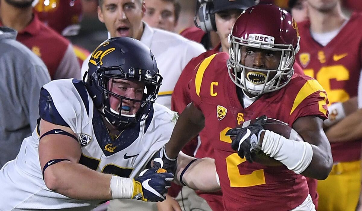 USC's Adoree' Jackson tries to avoid California's Evan Weaver during a punt return on Oct. 27.