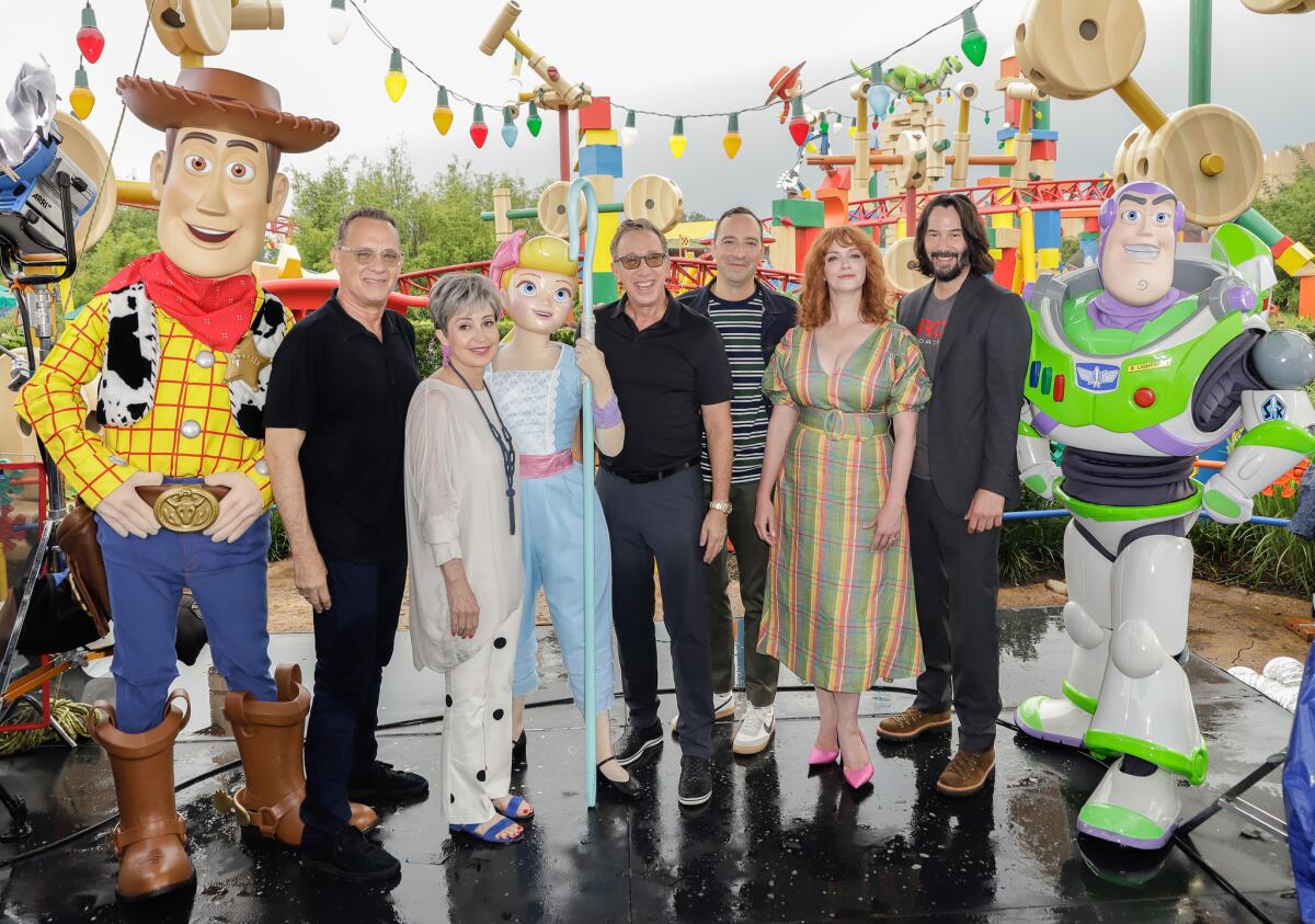 Tom Hanks, left, Annie Potts, Tim Allen, Tony Hale, Christina Hendricks and Keanu Reeves visit Toy Story Land at Disney's Hollywood Studios on June 8.