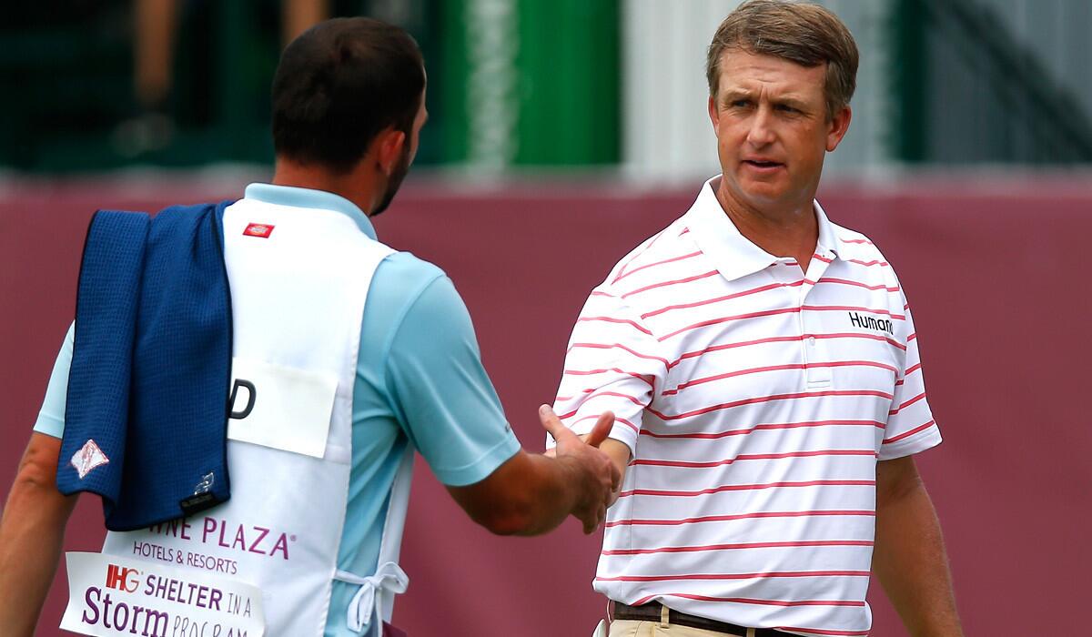 David Toms shakes hands with the caddie for playing partner Brendon Todd after finishing the third round on Saturday at Colonial.