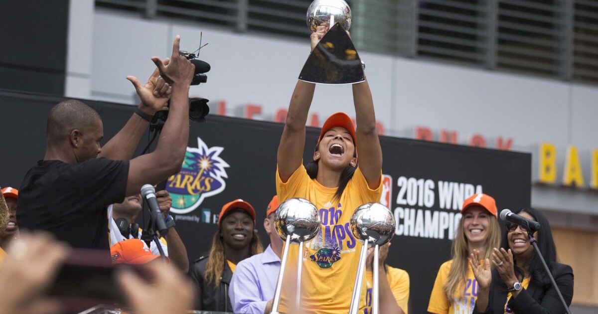 Los Angeles Sparks celebrate WNBA championship with their trophy and