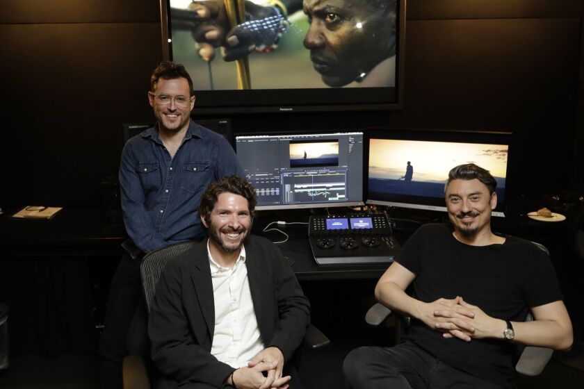 LOS ANGELES, CA -- APRIL 18, 2019: Martin Desmond Roe, left, founder; Chris Uettwiller, executive producer and Nick Frew, creative director of Dirty Robber film production company. The company has gained significant revenue from its work with brands, including documentaries that Nike and Apple invested in. For example, Dirty Robber shot a documentary on whether a group of men could run a marathon under two hours for Nike, which also featured Nike products. More brands are interested in investing in these types of documentaries, because they believe it will help break through the noise of social media through cinematic storytelling. As more consumers skip over commercials on traditional television and turn to subscription based streaming services, branded documentaries can be an effective way to reach them. (Myung J. Chun / Los Angeles Times)