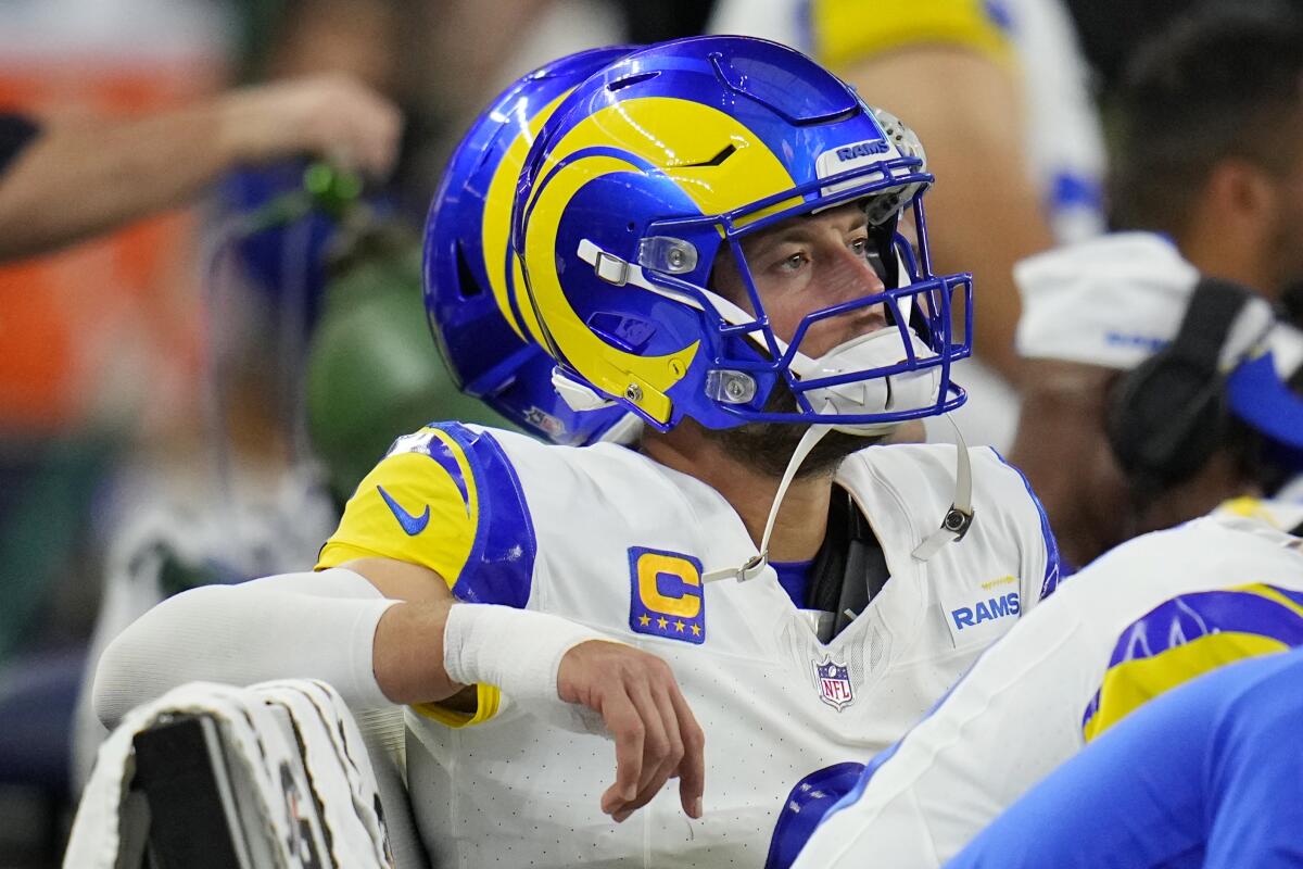 Rams quarterback Matthew Stafford watches from the bench in Dallas with a bandage on his throwing hand.