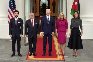 President Joe Biden, third left, and first lady Jill Biden, second right, greet Jordan's King Abdullah II, second left, Queen Rania, right, and Crown Prince Hussein, left, on the North Portico of the White House, Monday, Feb. 12, 2024, in Washington. (AP Photo/Evan Vucci)