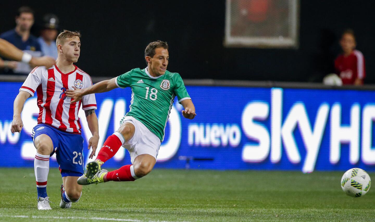 Mexico midfielder Andres Guardado (R) in action against Paraguay midfielder Robert Piris Da Motta (L) during the international friendly match between Mexico and Paraguay at the Georgia Dome in Atlanta, Georgia USA, 28 May 2016.