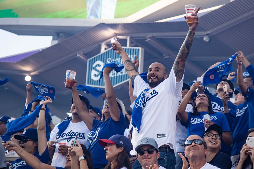 LOS ANGELES, CA - OCTOBER 3, 2019: Dodger fans cheer as the Dodgers starting line-up is announced before Game 1.
