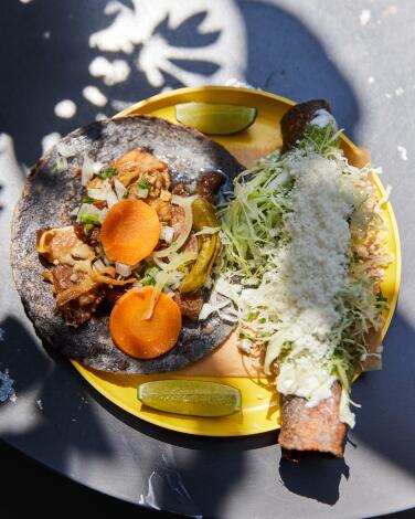 Carnitas Taco and Fish Flauta on a yellow plate at Ditroit Taqueria