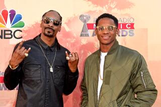 Recording artist Snoop Dogg and son Cordell Broadus