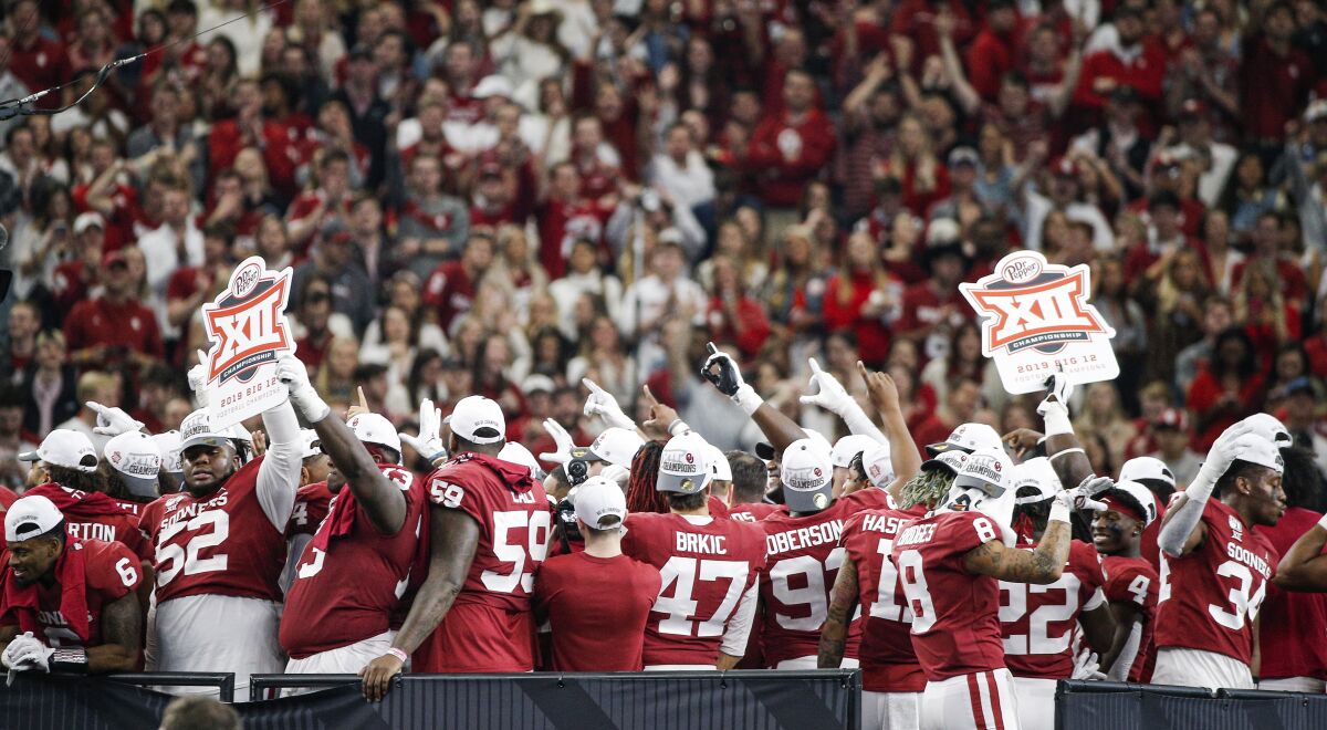 The Oklahoma Sooners celebrate a 30-23 overtime win over Baylor in the 2019 Big 12 championship game.