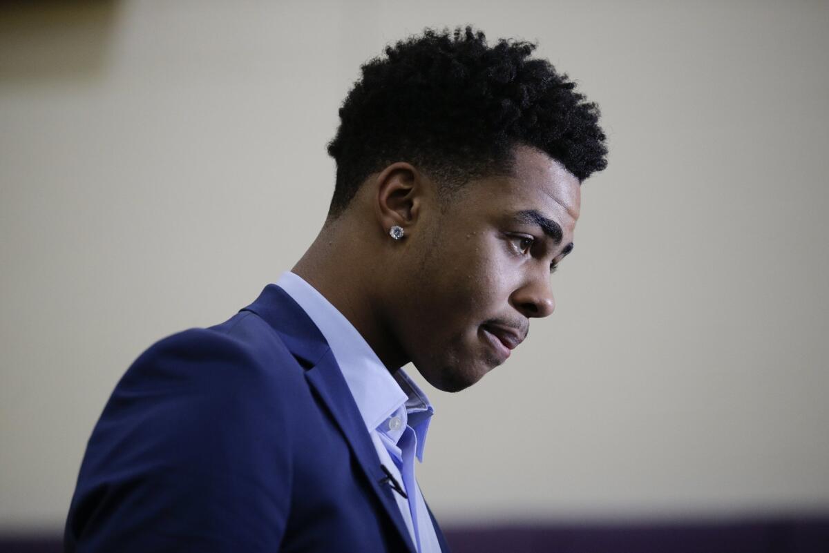 Los Angeles Lakers draft pick D'Angelo Russell listens to questions during a news conference, Monday, June 29, 2015, in El Segundo, Calif. Russell, the No. 2 NBA draft pick, was joined by fellow draftees Larry Nance Jr. and Anthony Brown. (AP Photo/Jae C. Hong)