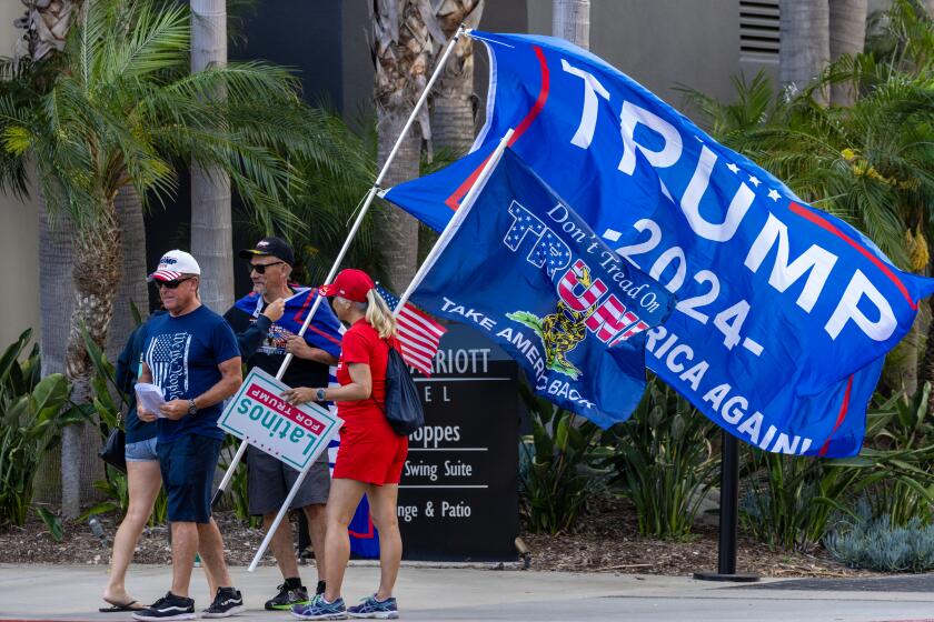 IRVINE, CA - JULY 29: Trump supporters gathered outside of a California GOP executive committee meeting to protests a change in the state's delegation-allocation rules on Saturday, July 29, 2023 at Marriott Hotel in Irvine, CA. (Irfan Khan / Los Angeles Times)