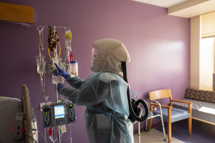 Registered nurse Shawna Gibson prepares IV and medications.