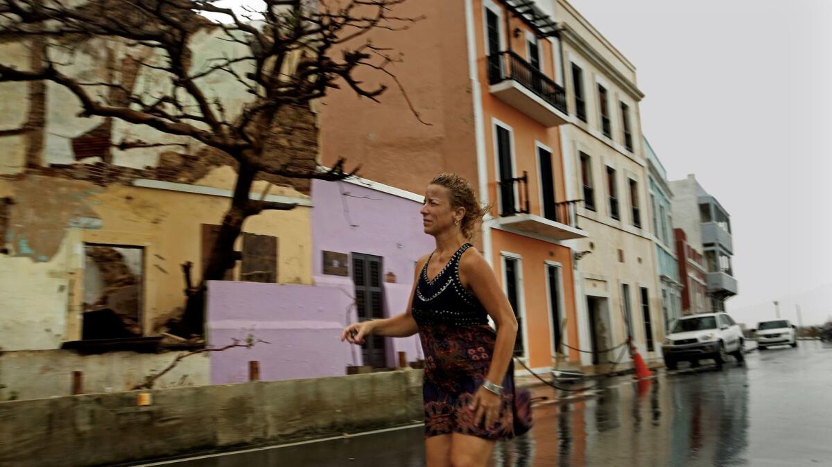 Rosa Avalo awoke in her home in Old San Juan to several inches of floodwater and a gaping hole in the bathroom wall. (Carolyn Cole / Los Angeles Times)